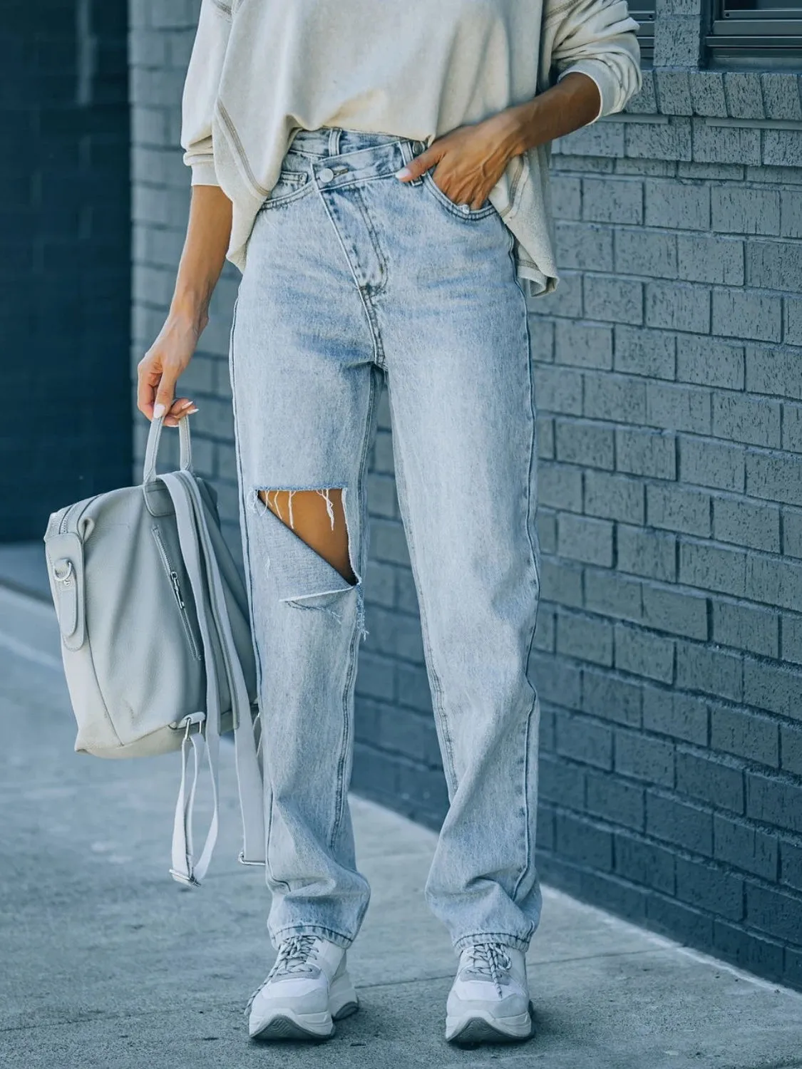 Distressed Asymmetric Waist Jeans